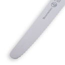 A close-up of the Messermeister Black Serrated Tomato Knife with Matching Sheath - 4.5" shows its micro-serrated blade, rounded tip, and partial Messermeister branding on the metal surface.