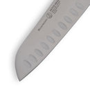 Close-up of a Messermeister Petite Messer Blue Kullens Santoku Knife - 5" blade, featuring the brand logo and oval granton edge indentations for smoother slicing. The partially visible silver blade is set against a white background.