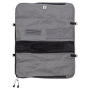 The Messermeister Preservation 12-Pocket Heather Gray Knife Roll by Messermeister features a gray zippered design with a mesh pocket, two small fabric pockets, and black side straps. Laid flat against a white background, it’s perfect for organized knife transport or as a compact kitchen knife storage solution.