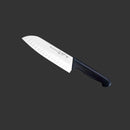The Messermeister Pro Series Kullens Santoku Knife - 7", featuring a high-carbon stainless steel blade with Kullens edge indentations and a black handle, is shown against a solid dark gray background.