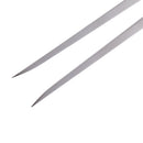 Close-up of the pointed stainless steel tips of the Messermeister Pro Series Straight Carving Fork - 7" by Messermeister against a white background.