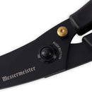 Close-up of Messermeister Push Button Take-Apart Poultry Shears - 10" in black, featuring a gold push button and circular joint mechanism, with "Messermeister" and "PUSH BUTTON" engraved on the high-carbon stainless steel handle.