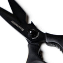 Close-up of Messermeister Push Button Take-Apart Multi Shears - 9", featuring a visible push button for detaching high-carbon stainless steel blades, shown in black against a white background.