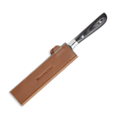 A kitchen knife with a dark handle is partially sheathed in a Messermeister Saddle Brown Leather Magnetic Edge-Guard - 8.5", which securely covers the blade while leaving the handle exposed.
