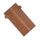 The Messermeister Saddle Brown Leather Magnetic Edge-Guard (8.5") is crafted from leather with visible stitching and side tabs, featuring the brand embossed in the center—ideal protection for your Messermeister knives.
