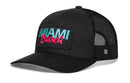 The Haka Hat Miami Beach Trucker Hat is a black snapback with a curved brim, blue and pink embroidered patch, black mesh sides and back, and an adjustable closure for the perfect fit.