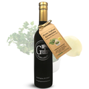 A dark bottle of Georgetown Olive Oil Co. ZESTY ITALIAN GREMOLATA | High Polyphenols Extra Virgin Olive Oil stands in front of fresh parsley and a lemon, highlighting their signature Cold Infusion from the Fresh Harvest Olive Oil collection.
