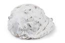 A scoop of white Millican Pecan Divinity Candy ice cream, featuring visible small brown pecan pieces and evocative of classic Southern confections, is photographed on a plain white background. This treat comes individually wrapped from the Millican Pecan brand.