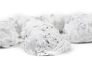 Close-up of several scoops of white ice cream dotted with small dark chocolate chips on a white background, evoking the creamy texture of Millican Pecan Divinity Candy - Individually Wrapped Southern Treat by Millican Pecan.