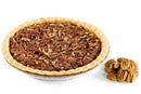 A Millican Pecan Southern Bourbon Pecan Pie - 9 Inch, presented in a tin pie dish, sits beside a small pile of shelled pecan nuts on a white background, highlighting this classic southern dessert from Millican Pecan.