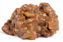 A close-up of a Southern candy classic, the Millican Pecan Texas Chewy Pecan Praline features a glossy caramel coating and visible pecan pieces on a white background, just like the individually wrapped treats cherished across the South.