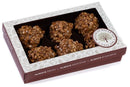 A gift box of five Millican Pecan Chewy Pecan Pralines, presented in a brown and white box labeled Millican Pecan, with the phrases “Always Fresh, Always Delicious, and Always Flavorful” printed on the side.