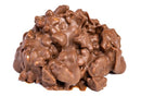 A close-up of a Millican Pecan Milk Chocolate Pecan Cluster reveals its glossy, gourmet chocolate coating against a plain white backdrop. This delectable treat from Millican Pecan is perfect for those who appreciate individually wrapped candy delights.