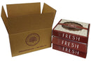 An open brown Millican Pecan box sits beside three stacked red boxes labeled “FRESH,” featuring decorative designs and a pecan logo on top—making it the perfect way to gift the Millican Pecan Delicious Texas Southern Pecan Pie (9 Inch).