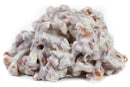 A close-up of the Millican Pecan White Chocolate Pecan Cluster—an individually wrapped gourmet treat from Millican Pecan—showcases crunchy pecans coated in a smooth, creamy white chocolate, set against a clean white background.