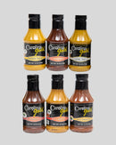 Six bottles of Gourmet Carolina Gold Mix-and-Match 6-Pack of Gourmet Carolina Gold BBQ Sauces in varying shades of yellow, orange, and red, arranged in two rows of three.