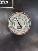 A close-up shows the Myron Mixon Smokers 5" High Visibility Temperature Gauge at about 220°F, with smoke, barbecue, and grill zones. The gauge face reads MYRON MIXON SMOKERS and "Made in USA" at the bottom.