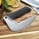 The NULU Knife and Dock Bundle from NULU Inc. features a curved-blade knife with a black textured handle, shown resting on a wooden cutting board beside sliced lemons, basil leaves, and a blue-and-white towel—an ergonomic kitchen essential designed for effortless meal prep and stylish countertop storage.