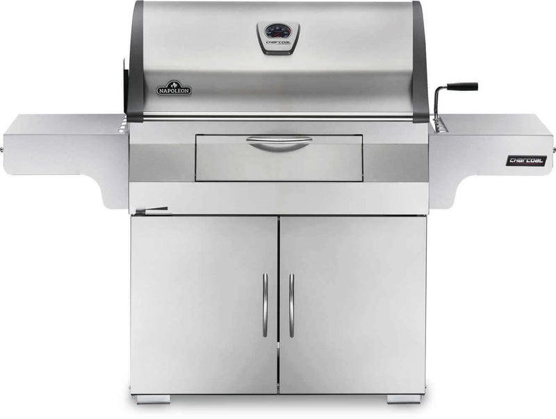 Napoleon PRO605CSS stainless steel charcoal cart grill with rear rotisserie burner and adjustable charcoal tray front of charcoal grill
