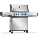 The Napoleon Grills Prestige 500 RSIB Stand Alone Gas Grill features four blue-lit knobs, stainless steel body, side shelves, lid temperature gauge, double-door storage, caster wheels, and powerful infrared side and rear burners.