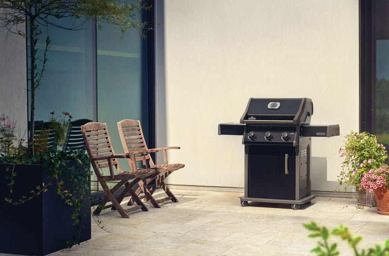 Napoleon Rogue 425 gas grill with foldable side shelves and porcelain cast iron grates at DDR BBQ Supply