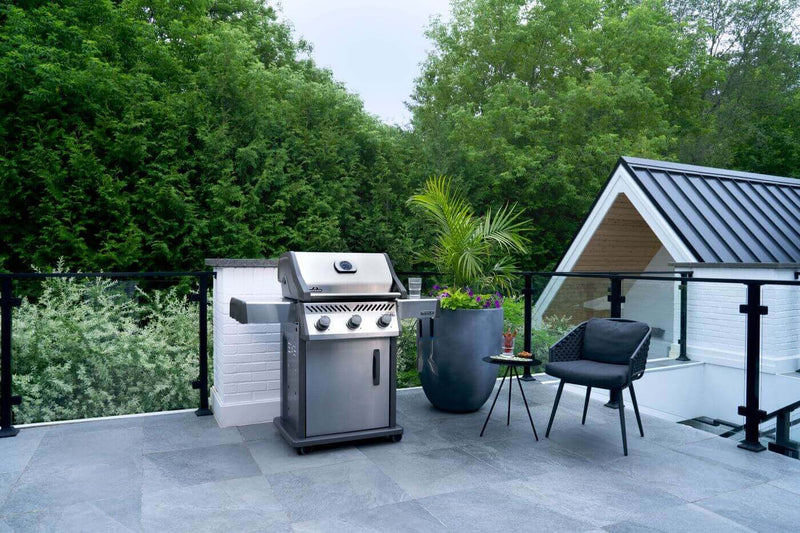 Napoleon Rogue 425 stainless steel gas grill with foldable side shelves and cast iron grates at DDR BBQ Supply