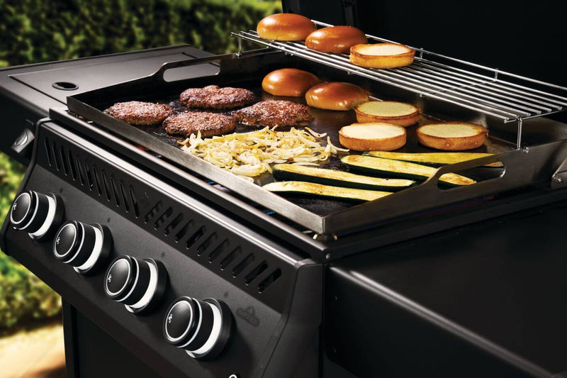 Napoleon Rogue PRO Phantom 30 Inch Griddle outdoor gas griddle with stainless steel cooktop  with food shown at DDR BBQ Supply. 