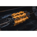Marinated chicken skewers are cooked hands-free on the Napoleon Grills Rotisserie Shish-Kebab Skewer Set with Removable Skewers (64008), which rotates above the grill grates for even, effortless grilling.