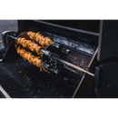 Two skewers of marinated meat cook hands-free over an open flame on the Napoleon Rotisserie Shish-Kebab Skewer Set (64008) by Napoleon Grills, with the grill’s lid open to reveal juicy kebabs above the grates.