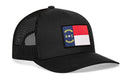 Show your state pride with the Haka Hat North Carolina Flag Trucker Hat—a black snapback from Haka Hat featuring a bold NC flag patch on the front panel and breathable mesh for comfort.