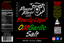 A vibrant Pawpa Flavor LLC Bearly Legal OMGarlic Salt label showcases a distinctive bear logo along with nutritional facts and product information. The design features bold red, yellow, and green accents, colorful text, and social media handles. This attention-grabbing label highlights the all-natural seasoning blend from Pawpa Flavor LLC and promises a savory garlic flavor that transforms any dish into an unforgettable meal.