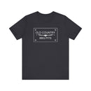 The Old Country BBQ Pits Vintage Logo T-Shirt by Printify features a white rectangular logo with longhorn steer head—an essential addition to any pitmaster's collection.