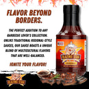 A bottle of Blazing Star BBQ Original Sauce by Blazing Star BBQ sits alongside ribs on a plate, with fire graphics and text highlighting the sauce’s multicultural flavor blend and bold, balanced BBQ taste.
