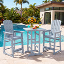 Two light blue DirectDeals Outdoor Bar Stool 29″ Height with Backrest and Armrests and a matching table stand by a pool, topped with drinks, flowers, and fruit. Lush greenery and a modern house complete the scene.