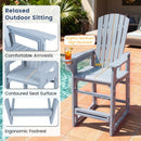 A tall, light blue Outdoor Bar Stool 29″ Height with Backrest and Armrests by DirectDeals stands on the patio, showcasing ergonomic HDPE seating with wide arms, a contoured seat, footrest, and a high reclined back.