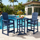 Two blue DirectDeals Outdoor Bar Stool 29″ Height with Backrest and Armrests are arranged by a poolside table with flowers, fruit, and drinks. Palm trees and a modern house sit in the sunny background.