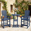 Two blue Adirondack chairs and a matching DirectDeals Outdoor Bar Stool 29″ Height with Backrest and Armrests sit on a stone patio beside a rustic stone building covered in green vines and flowers.