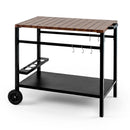 The DirectDeals Outdoor Grill Cart with Stainless Steel Top and Storage features two wheels, a lower shelf, utensil hooks, and a bottle holder—perfect as a BBQ prep or serving station outdoors.