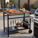 The DirectDeals Outdoor Grill Cart with Stainless Steel Top and Storage keeps meats, fruits, tools, condiments, charcoal, and wine organized beside your grill in a modern backyard.