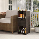 The DirectDeals Outdoor Storage Cabinet Patio Wicker Organizer with Drawer sits beside a sofa, storing drinks and glassware amid potted flowers and a sunlit patio with a white railing.