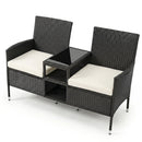 The DirectDeals Outdoor Wicker Loveseat with Built-in Glass Side Table features two white cushions, a handy glass side table, and open storage below—perfect for stylish outdoor seating.