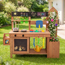 The Outdoor Wooden Mud Kitchen with Planter Box and Sink by DirectDeals includes a sink, toy pots, pans, utensils, watering can, chalkboard for doodles, plastic chicks below, and side flowers—perfect for kids’ backyard play.