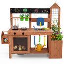 The DirectDeals Outdoor Wooden Mud Kitchen with Planter Box and Sink includes pots, pans, toy tools, plants, flowers, a blackboard, watering can, and toy chicks—ideal for fun backyard play.