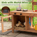 Six ducklings sit on straw inside a wooden cabinet, surrounded by toy kitchen items—perfect for backyard play with the DirectDeals Outdoor Wooden Mud Kitchen with Planter Box and Sink.