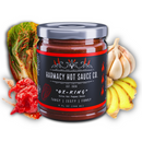 A jar of Harmacy Hot Sauce Co. Ox-King Extra Hot Kimchi Sauce 9oz is displayed with bok choy, ginger, garlic, and red chili pepper, highlighting its bold kimchi flavor and superhot peppers.