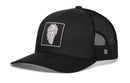 The Haka Hat Oyster Shell Trucker Hat is a black snapback featuring a curved bill, oyster shell patch, and breathable mesh panels—perfect for any adventure.