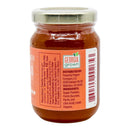 A small glass jar with a metal lid, labeled “Powerful Pepper Company.” The label reads "Powerful Pepper Peach Fatalii Jam" and features the distributor’s information and nutrition facts. The ingredients listed are sugar, Georgia peaches, pectin, and fatalii peppers, highlighting this unique jam crafted with Georgia-grown produce.