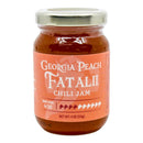 A glass jar of Powerful Pepper Peach Fatalii Jam from Powerful Pepper Company features a silver lid and a peach-colored label designed to showcase the bold flavor of Georgia peaches and the zesty kick of Fatalii Pepper. The label displays a heat level of 4/10 and indicates a net weight of 4 oz (113g).