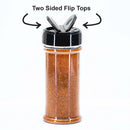 A 12-pack of The Spice Lab plastic shaker jars, each with brown seasoning and a black lid featuring two open flip tops, is labeled with “Two Sided Flip Tops—perfect for seasoning organization and convenient spice storage.”.