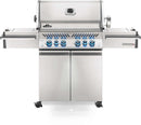 Stainless steel grill with multiple burners on a white background